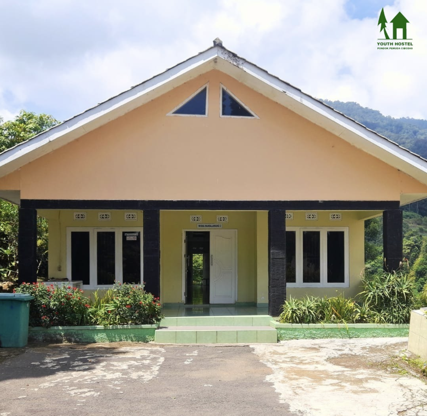 Executive suite with separate living area, work desk, and luxury bathroom